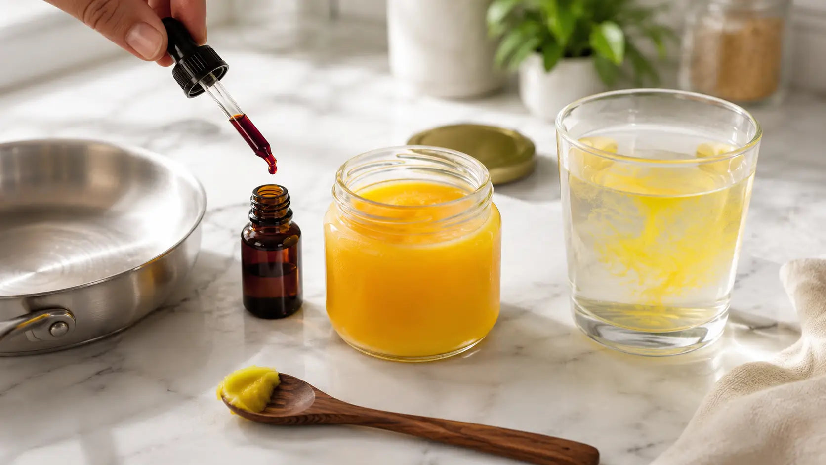 A glass jar of golden ghee being tested with an iodine dropper on a white kitchen counter surrounded by testing materials including a small pan and spoon