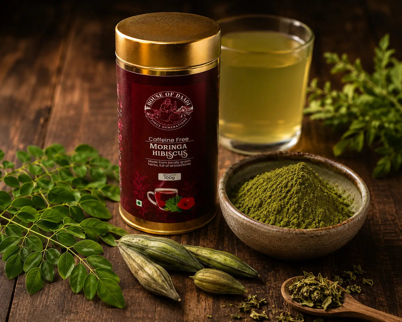 Fresh moringa leaves, moringa powder in a wooden bowl, and moringa seed pods arranged on a rustic surface with warm natural light highlighting their vibrant green colour